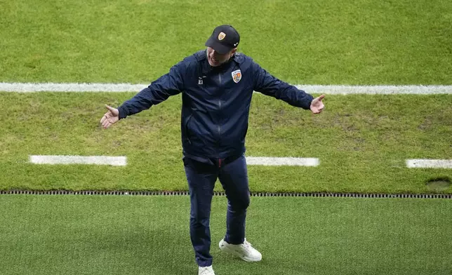 Romania's head coach Edward Iordanescu gestures during a Group E match against Slovakia at the Euro 2024 soccer tournament in Frankfurt, Germany, Wednesday, June 26, 2024. (AP Photo/Darko Vojinovic)