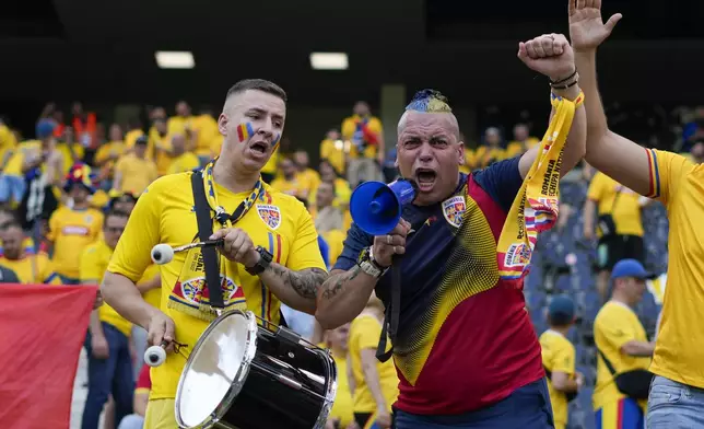 Romanian fans cheer before the kick-off of a Group E match against Slovakia at the Euro 2024 soccer tournament in Frankfurt, Germany, Wednesday, June 26, 2024. (AP Photo/Themba Hadebe)