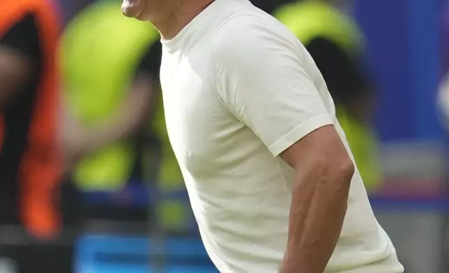 Slovakia's coach Francesco Calzona shouts instructions to his players during a Group E match at the Euro 2024 soccer tournament against Romania in Frankfurt, Germany, Wednesday, June 26, 2024. (AP Photo/Themba Hadebe)