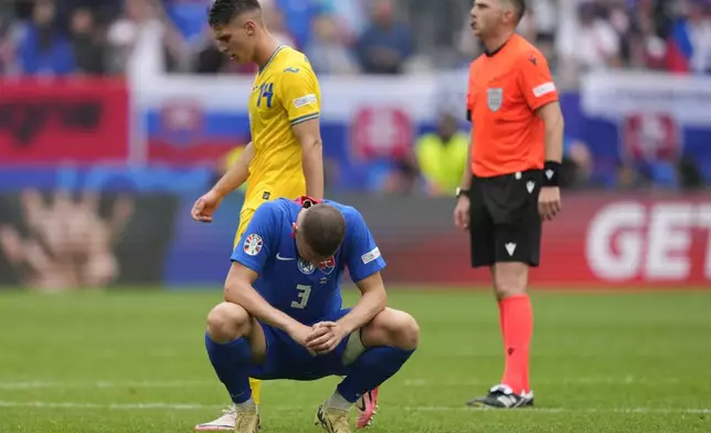 Slovakia's Denis Vavro is dejected at the end of a Group E match between Slovakia and Ukraine at the Euro 2024 soccer tournament in Duesseldorf, Germany, Friday, June 21, 2024. (AP Photo/Andreea Alexandru)