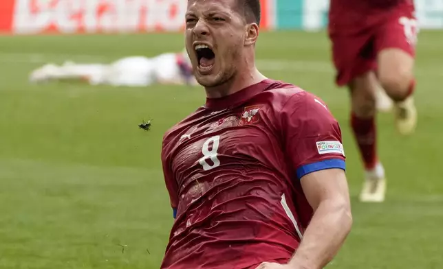 Serbia's Luka Jovic celebrates after scoring his side first goal during a Group C match between Slovenia and Serbia at the Euro 2024 soccer tournament in Munich, Germany, Thursday, June 20, 2024. (AP Photo/Matthias Schrader)