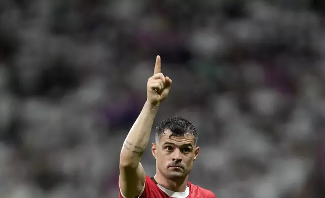 Switzerland's Granit Xhaka gestures during a Group A match between Switzerland and Germany at the Euro 2024 soccer tournament in Frankfurt, Germany, Sunday, June 23, 2024. (AP Photo/Darko Vojinovic)