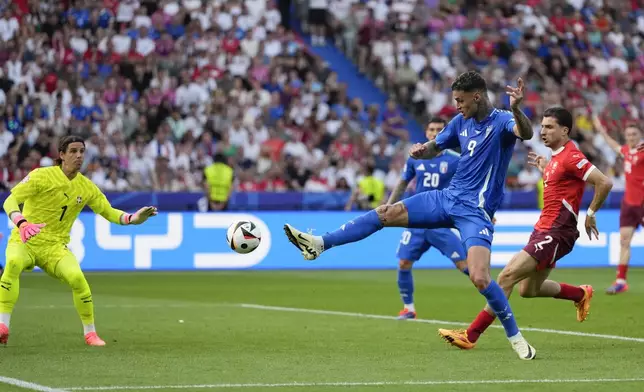Italy's Gianluca Scamacca shoots on goal during a round of sixteen match between Switzerland and Italy at the Euro 2024 soccer tournament in Berlin, Germany, Saturday, June 29, 2024. (AP Photo/Matthias Schrader)