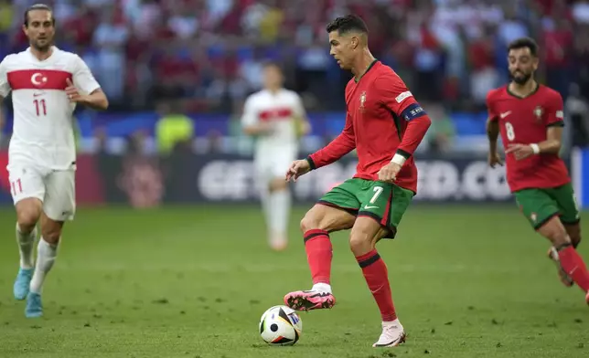 Portugal's Cristiano Ronaldo in action during a Group F match between Turkey and Portugal at the Euro 2024 soccer tournament in Dortmund, Germany, Saturday, June 22, 2024. (AP Photo/Darko Vojinovic)