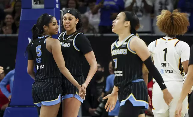 Chicago Sky forward Angel Reese (5) and center Kamilla Cardoso (10) celebrate a foul on the Indiana Fever during a WNBA basketball game, Sunday, June 23, 2024, in Chicago. (Eileen T. Meslar/Chicago Tribune via AP)