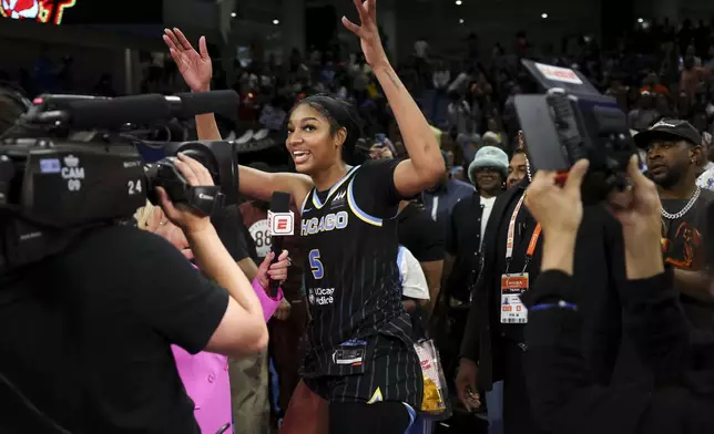 Chicago Sky forward Angel Reese (5) is interviewed by Holly Rowe after the Sky defeated the Indiana Fever, 88-87, in a WNBA basketball game, Sunday, June 23, 2024, in Chicago. (Eileen T. Meslar/Chicago Tribune via AP)