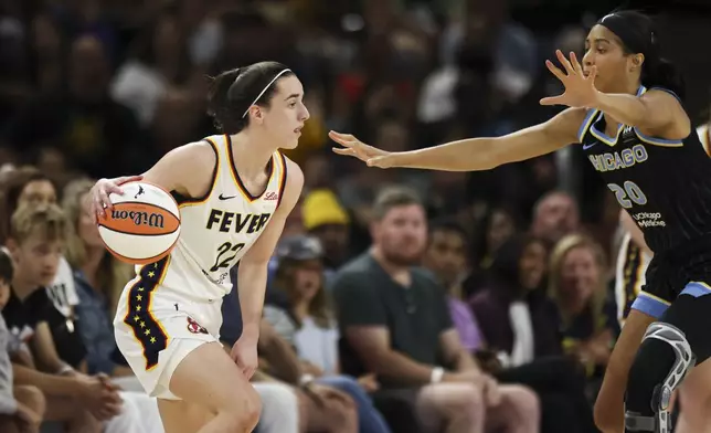 Chicago Sky forward Isabelle Harrison (20) guards Indiana Fever guard Caitlin Clark (22) during a WNBA basketball game, Sunday, June 23, 2024, in Chicago. (Eileen T. Meslar/Chicago Tribune via AP)