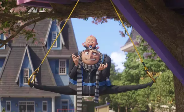 This image release by Illumination &amp; Universal Pictures shows Gru, voiced by Steve Carell, and Gru Jr. in a scene from "Despicable Me 4," (Illumination &amp; Universal Pictures via AP)