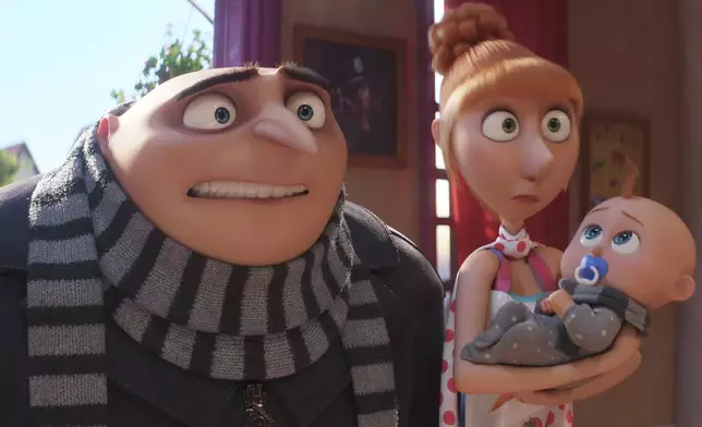 This image release by Illumination &amp; Universal Pictures shows Gru, voiced by Steve Carell, left, and Lucy, voiced by Kristen Wiig, holding Gru Jr. in a scene from "Despicable Me 4," (Illumination &amp; Universal Pictures via AP)