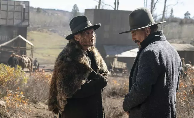 This image released by Warner Bros. Pictures shows Jamie Campbell Bower, left, and Kevin Costner in a scene from "Horizon: An American Saga-Chapter I." (Warner Bros. Pictures via AP)