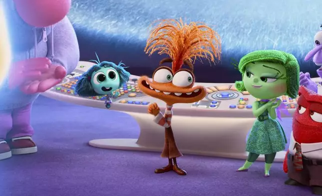 This image released by Disney/Pixar shows, from left, Joy, voiced by Amy Poehler, Embarrassment, voiced by Paul Walter Hauser, Envy, voiced by Ayo Edebiri, Anxiety, voiced by Maya Hawke, Disgust, voiced by Liza Lapira, Anger, voiced by Lewis Black (foreground), Fear, voiced by Tony Hale, and Sadness, voiced by Phyllis Smith, in a scene from "Inside Out 2." (Disney/Pixar via AP)