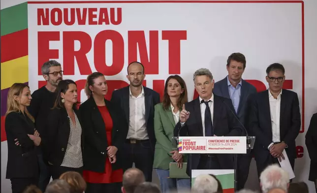 Communist Party national secretary Fabien Roussel, gestures as he speaks during media conference as he is surrounded by leaders of France left-wing coalition for the upcoming election attend a media conference in Paris, Friday, June 14, 2024. Leaders of France's left-wing parties, allied in a coalition known as the New Popular Front on Friday outlined their plan to fend off the far-right from claiming power at the upcoming snap national election. (AP Photo/Thomas Padilla)