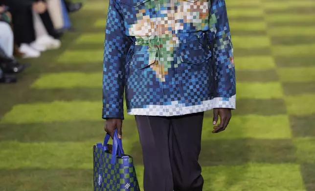 A model wears a creation as part of the Louis Vuitton Spring Summer 2025 collection, that was presented in Paris, France, Tuesday, June 18, 2024. (Photo by Vianney Le Caer/Invision/AP)
