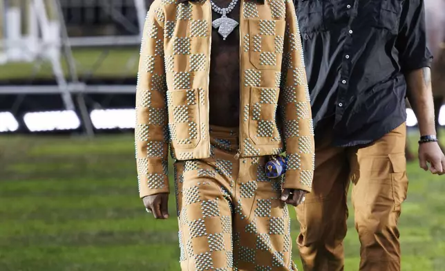 Burna Boy arrives for the Louis Vuitton Spring Summer 2025 collection, that was presented in Paris, France, Tuesday, June 18, 2024. (Photo by Vianney Le Caer/Invision/AP)