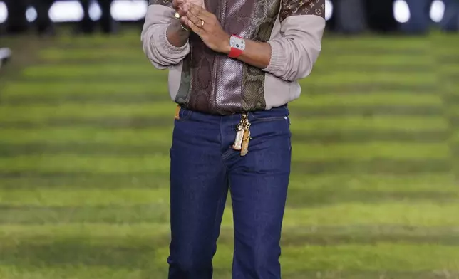 Creative director Pharrell Williams accepts applause following the Louis Vuitton Spring Summer 2025 collection, that was presented in Paris, Tuesday, June 18, 2024. (Photo by Vianney Le Caer/Invision/AP)