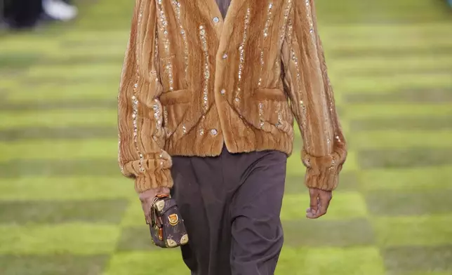 A model wears a creation as part of the Louis Vuitton Spring Summer 2025 collection, that was presented in Paris, Tuesday, June 18, 2024. (Photo by Vianney Le Caer/Invision/AP)