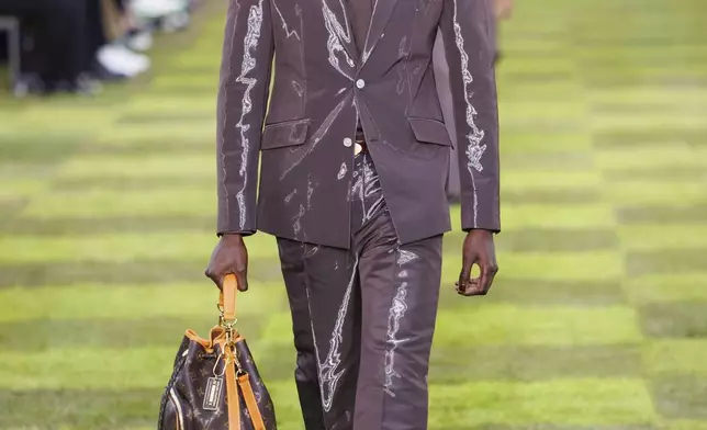 A model wears a creation as part of the Louis Vuitton Spring Summer 2025 collection, that was presented in Paris, Tuesday, June 18, 2024. (Photo by Vianney Le Caer/Invision/AP)