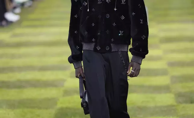 A model wears a creation as part of the Louis Vuitton Spring Summer 2025 collection, that was presented in Paris, France, Tuesday, June 18, 2024. (Photo by Vianney Le Caer/Invision/AP)
