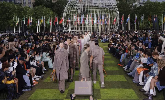 Models wear creations as part of the Louis Vuitton Spring Summer 2025 collection, that was presented in Paris, Tuesday, June 18, 2024. (Photo by Vianney Le Caer/Invision/AP)