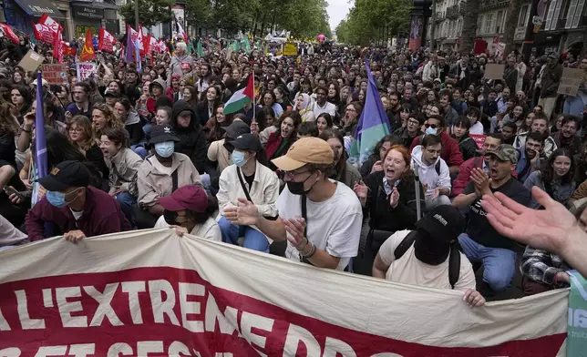 Protesters attend a rally in Paris, Saturday, June 15, 2024. Anti-racism groups joined French unions and a brand-new left-wing coalition in protests in Paris and across France on Saturday against the surging nationalist far right as frenzied campaigning is underway ahead of snap parliamentary elections. (AP Photo/Michel Euler)