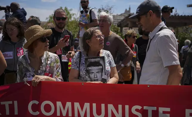 Members of the French communist party march during a demonstration in Marseille, southern France, Saturday, June 15, 2024. Anti-racism groups joined French unions and a brand-new left-wing coalition in protests in Paris and across France on Saturday against the surging nationalist far right as frenzied campaigning is underway ahead of snap parliamentary elections. (AP Photo/Daniel Cole)