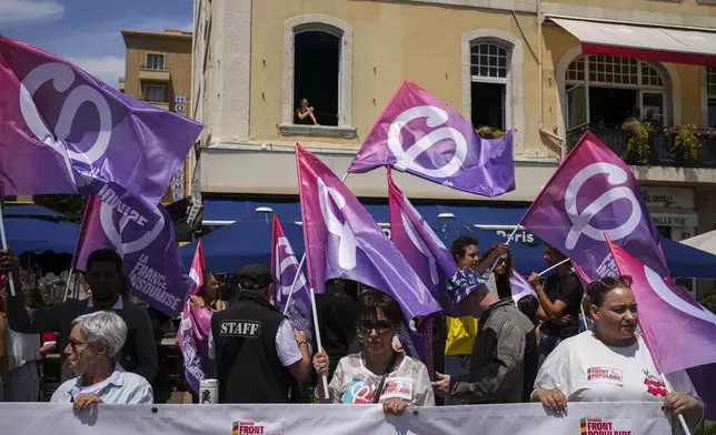 Protesters march during a demonstration in Marseille, southern France, Saturday, June 15, 2024. Anti-racism groups joined French unions and a brand-new left-wing coalition in protests in Paris and across France on Saturday against the surging nationalist far right as frenzied campaigning is underway ahead of snap parliamentary elections. (AP Photo/Daniel Cole)