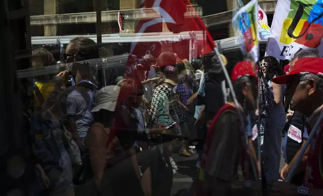 Protesters march during a demonstration in Marseille, southern France, Saturday, June 15, 2024. Anti-racism groups joined French unions and a brand-new left-wing coalition in protests in Paris and across France on Saturday against the surging nationalist far right as frenzied campaigning is underway ahead of snap parliamentary elections. (AP Photo/Daniel Cole)