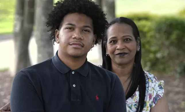 Robin Alderman, right, and her son, Camden Alderman, 21, who has a rare disease called Wiskott-Aldrich syndrome, pose for a portrait near their home in Greensboro, N.C., Wednesday, June 12, 2024. (AP Photo/Chuck Burton)