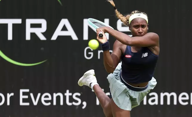 Coco Gauff of the U.S. returns a ball against Tunisia's Ons Jabeur during their singles women quarterfinals match of the WTA Tour in Berlin, Saturday June 22, 2024. (Andreas Gora/dpa via AP)