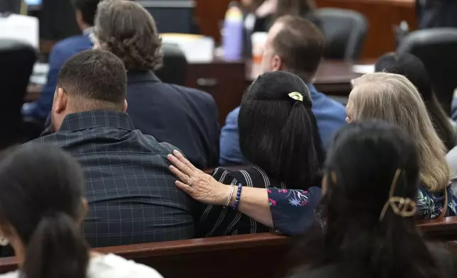 Family of Jocelyn Nungaray comfort each other as Franklin Peña, one of the two men accused of killing the 12-year-old girl, appears in court, Monday, June 24, 2024, in Houston. Peña was ordered held on $10 million bail as he and another man, Johan Jose Rangel-Martinez, are charged with capital murder over the girl's death. (Brett Coomer/Houston Chronicle via AP)