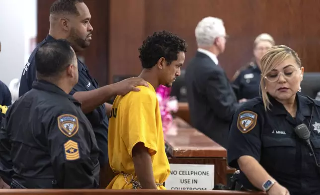 Franklin Peña, one of the two men accused of killing 12-year-old Jocelyn Nungaray, is led into the courtroom, Monday, June 24, 2024, in Houston. Peña was ordered held on $10 million bail as he and another man, Johan Jose Rangel-Martinez, are charged with capital murder over the girl's death. (Brett Coomer/Houston Chronicle via AP)