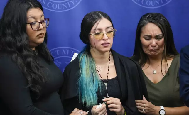 Alexis Nungaray, the mother of Jocelyn Nungaray, center, is embraced by Tiffany Carmona, left, and Jackie Major after speaking about her daughter during a news conference after Franklin Peña, one of the two men accused of killing the 12-year-old girl, appeared in court, Monday, June 24, 2024, in Houston. Peña was ordered held on $10 million bail as he and another man, Johan Jose Rangel-Martinez, are charged with capital murder over the girl's death. (Brett Coomer/Houston Chronicle via AP)