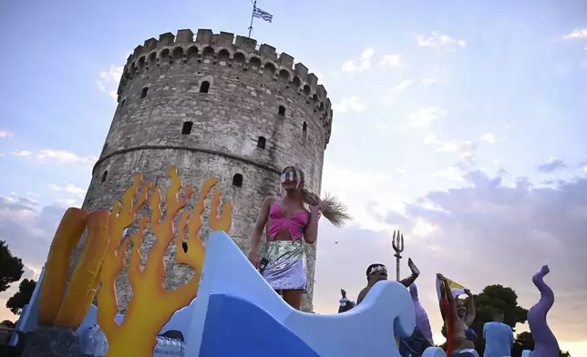 Revellers gather in front of the White Tower during EuroPride, a pan-European international LGBTI event featuring a Pride parade which is hosted in a different European city each year, in the northern port city of Thessaloniki, Greece, Saturday, June 29, 2024. (AP Photo/Giannis Papanikos)