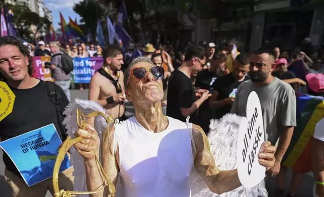 A reveller takes part in EuroPride, a pan-European international LGBTI event featuring a Pride parade which is hosted in a different European city each year, in the northern port city of Thessaloniki, Greece, Saturday, June 29, 2024. (AP Photo/Giannis Papanikos)