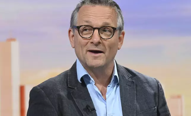 In this undated photo provided by the BBC on Sunday, June 9, 2024, doctor and broadcaster Michael Mosley speaks on Sunday with Laura Kuenssberg. Police said that a body believed to be that of missing British TV presenter Michael Mosley was found on a Greek island Sunday morning. A police spokesman, who spoke on condition of anonymity because of an ongoing investigation, said the body was found on a rocky coast by a private boat and that formal identification was pending. (Jeff Overs/BBC via AP)