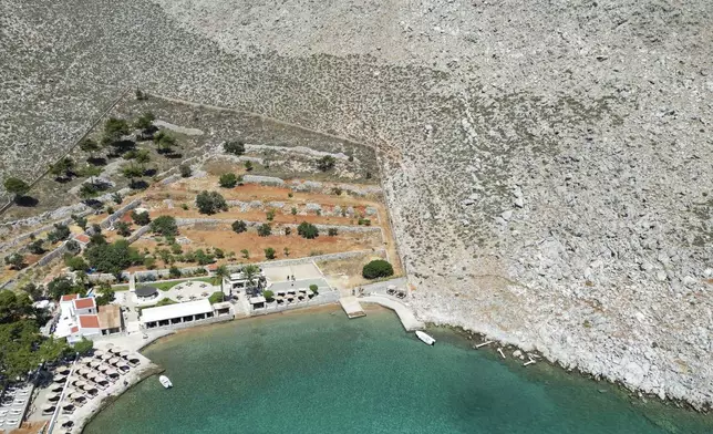 A general view of the area where the body of missing British TV presenter Michael Mosley was found, Sunday, June 9, 2024. The family of missing British TV presenter Dr. Michael Mosley have confirmed his body has been found on a Greek island. Mosley’s wife said Sunday in a statement that her husband had gone for a hike and took the wrong route and collapsed in a place where his body couldn’t easily be seen. (AP Photo/Panormitis Chatzigiannakis)