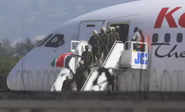 Police from Kenya deplane at the Toussaint Louverture International Airport in Port-au-Prince, Haiti, Tuesday, June 25, 2024. The first U.N.-backed contingent of foreign police arrived nearly two years after the Caribbean country requested help to quell a surge in gang violence. (AP Photo/Odelyn Joseph)