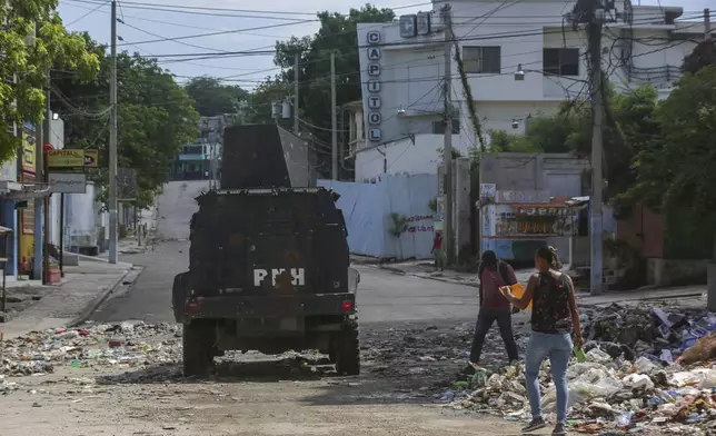 An armored police vehicle patrols in Port-au-Prince, Haiti, Monday, June 24, 2024. (AP Photo/Odelyn Joseph)