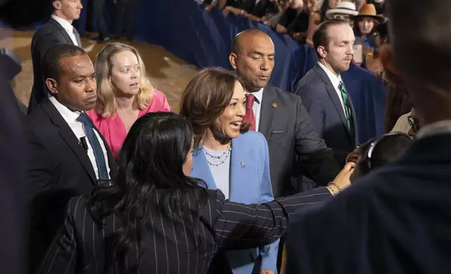 Vice President Kamala Harris greets supporters after speaking at a post debate campaign rally, Friday, June 28, 2024, in Las Vegas. (AP Photo/Ronda Churchill)