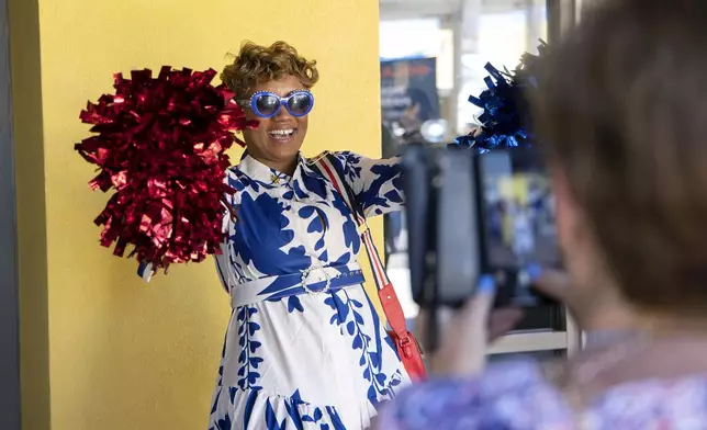 Leslie S. West is photographed by Deanna Waters before Vice President Kamala Harris speaks at a post Presidential debate campaign rally, Friday, June 28, 2024, in Las Vegas. (AP Photo/Ronda Churchill)