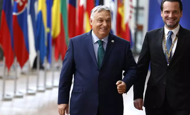 FILE - Hungary's Prime Minister Viktor Orban, left, arrives for an EU summit in Brussels, June 27, 2024. When Hungary takes over the helm of the European Union on Monday July 1, 2024 many politicians in Brussels will have the same thing on their minds: whether populist Prime Minister Viktor Orbán will use the role to further his reputation as the bloc’s main spoiler. (AP Photo/Geert Vanden Wijngaert, File)