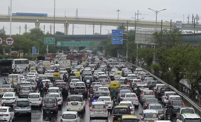 Vehicles are stuck in traffic on a highway near the Indira Gandhi International Airport after a heavy downpour disrupted vehicular movement in New Delhi, India, Friday, June 28, 2024. (AP Photo)