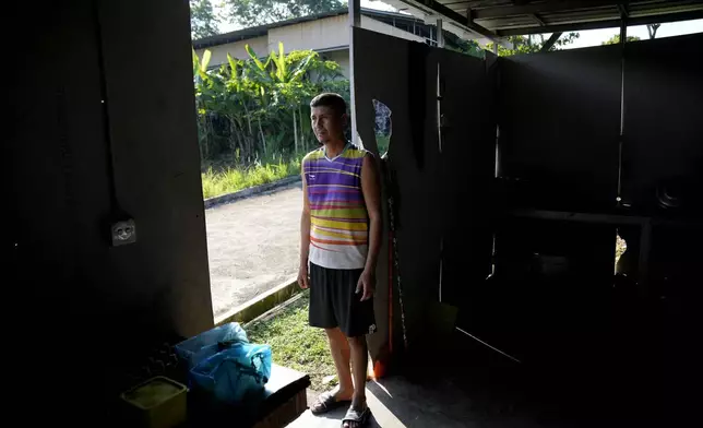 Mohammad Khan Husaini, a 30-year-old Afghan who has been in Indonesia for 11 years, stands at a resort turned into a shelter in Tanjungpinang, Bintan Island, Indonesia, Tuesday, May 14, 2024. Many refugees had fled to the sprawling Southeast Asian archipelago as a jumping-off point hoping to eventually reach Australia by boat, but are now stuck in what feels like an endless limbo. (AP Photo/Dita Alangkara)