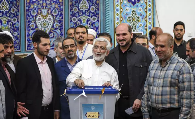 In this photo provided by Iranian Students' News Agency, ISNA, hard-line former Iranian senior nuclear negotiator and candidate for the presidential election Saeed Jalili casts his ballot in a polling station, in Tehran, Iran, Friday, June 28, 2024. Iranians are voting in a snap election to replace the late hard-line President Ebrahim Raisi. (Alireza Sotakabr, ISNA via AP)