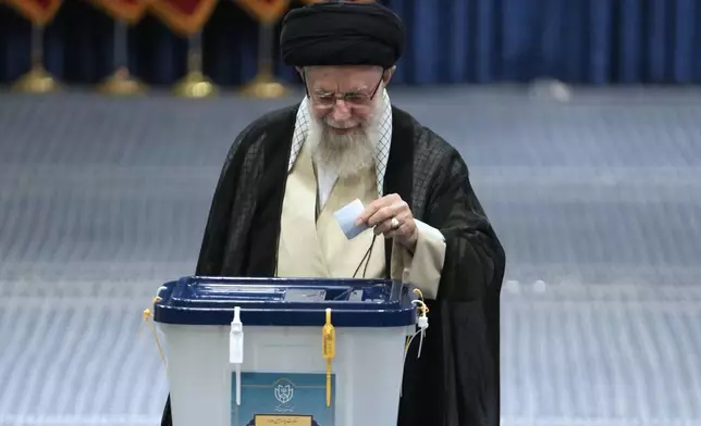 Iranian Supreme Leader Ayatollah Ali Khamenei casts his ballot during the presidential election, in Tehran, Iran, Friday, June 28, 2024. Iranians were voting Friday in a snap election to replace the late President Ebrahim Raisi, killed in a helicopter crash last month, as public apathy has become pervasive in the Islamic Republic after years of economic woes, mass protests and tensions in the Middle East. (AP Photo/Vahid Salemi)
