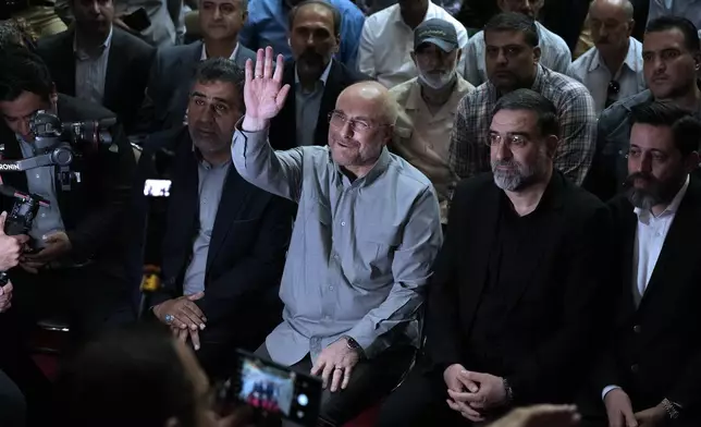 Mohammad Bagher Qalibaf, the most prominent candidate for the June 28, presidential election, who is Iran's parliament speaker, waves to media in his campaign rally in Tehran, Iran, Tuesday, June 18, 2024. (AP Photo/Vahid Salemi)