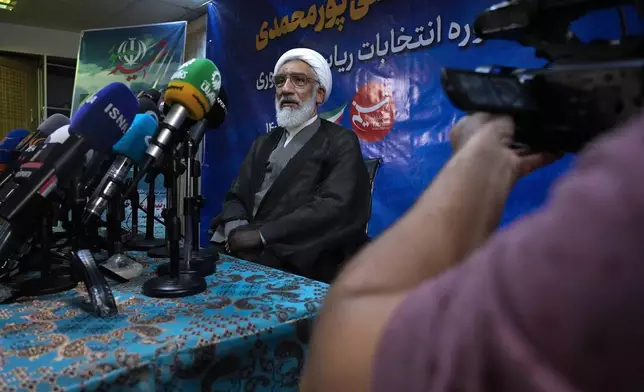 Candidate for June 28, Iran's presidential election Mostafa Pourmohammadi, a former Minister of Justice, sits in his press conference in Tehran, Iran, Sunday, June 23, 2024. (AP Photo/Vahid Salemi)