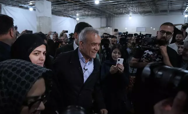 Reformist candidate for Iran's June 28, presidential election Masoud Pezeshkian arrives for a campaign rally in Tehran, Iran, Friday, June 14, 2024. (AP Photo/Vahid Salemi)