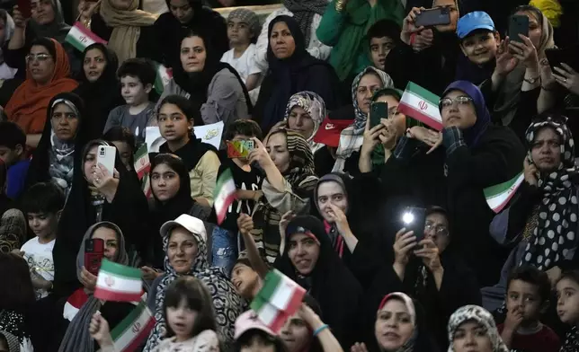 Supporters of Tehran Mayor Alireza Zakani, a candidate for the June 28 presidential election, attend his campaign rally in Tehran, Iran, Sunday, June 23, 2024. (AP Photo/Vahid Salemi)