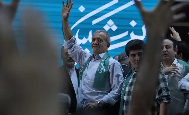 Reformist candidate for Iran's June 28, presidential election Masoud Pezeshkian waves to his supporters during his campaign rally in Tehran, Iran, Sunday, June 23, 2024. (AP Photo/Vahid Salemi)